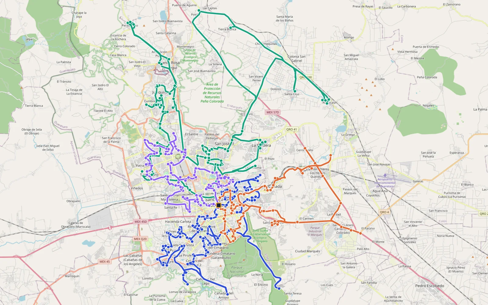 Map of Querétaro with the four routes of the run: blue in the center, green to the north, orange to the east and purple to the west, with the distribution center in the middle.